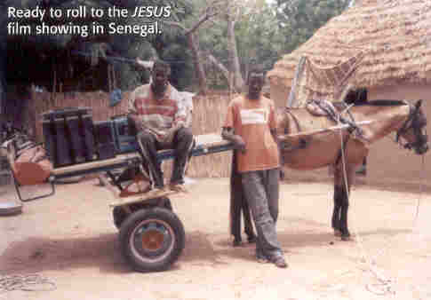 Jesus Film equipment is transported by a horse-drawn cart